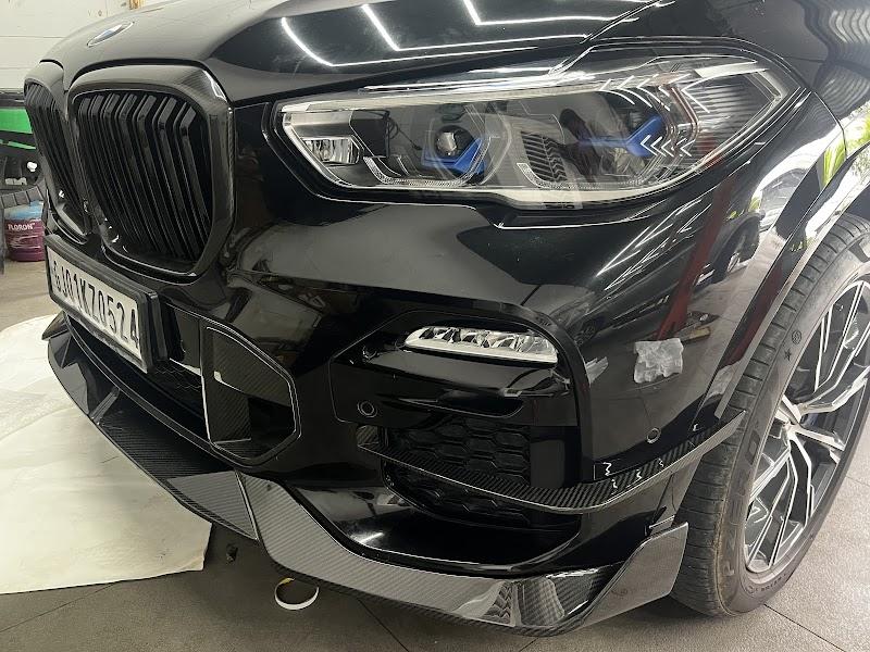 Black BMW X5 with aggressive body kit and gloss black grille, V8Hub Thaltej