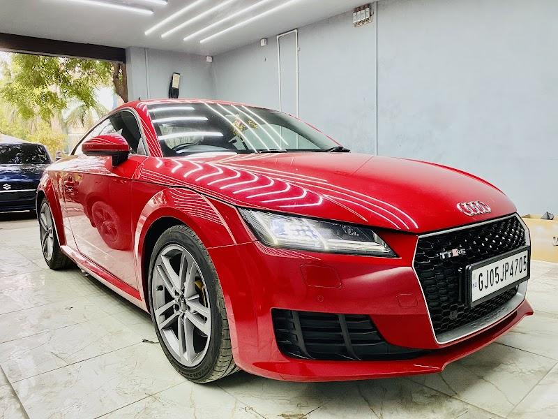 Red Audi TT front three-quarter in the V8Hub Thaltej workshop
